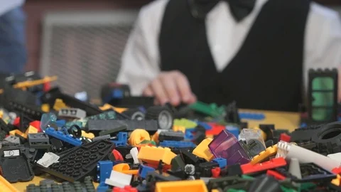 Hands of unknown child playing with building kit Stock Footage 83146174