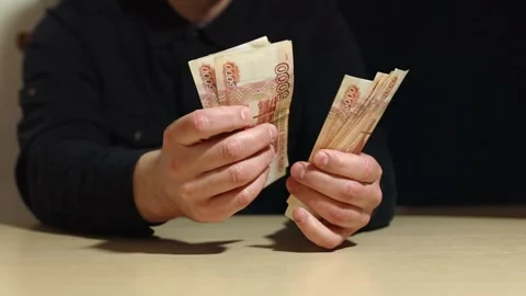 The hands of an unknown man count Russian rubles Stock Footage 169542290