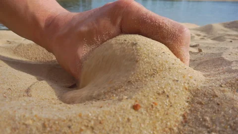 Hands of an unknown young man touch the white sand. Stock Footage 111390724