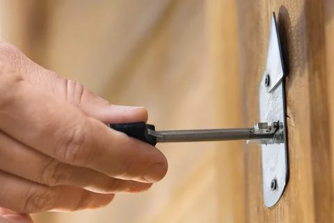 Hands unlocking door Stock Photos