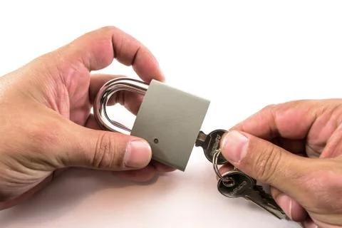 Hands Unlocking a Padlock Stock Photos