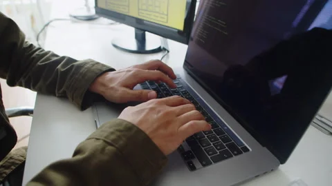 Hands of Unrecognizable Coder Creating New Software Working on Laptop Stock Footage 256978436