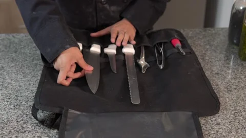 Hands of an unrecognizable female chef opening a case to show professional .. Stock Footage 282310524