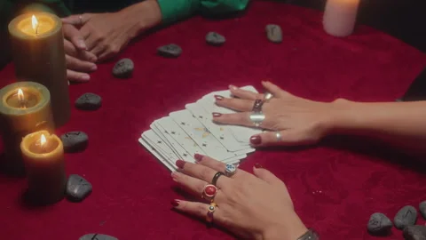 Hands of Unrecognizable Fortune Teller Taking One Card from Tarot Layout Stock Footage 253182307
