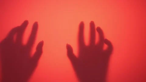 Hands of unrecognizable lady slowly touching wall illuminated by contour light Stock Footage 251525490