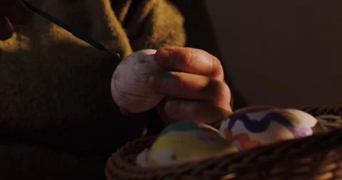Hands of unrecognizable woman using brush and painting on Easter egg Stock Footage 269761465