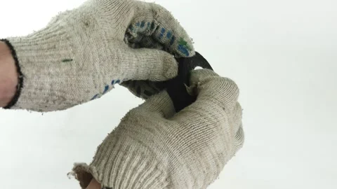 Hands unwind a roll of black electrical tape. Prepare for repair. Stock Footage 143014234