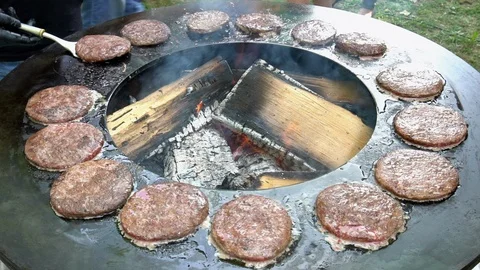Hands upturn baking minced meat pieces for burgers. Handheld shot. Stock-Footage 109504327