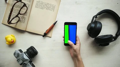Hands use phone with differed chroma key screens - red, blue, green Video stock 80556782
