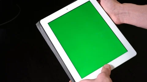 Hands Use a Tablet with a Green Screen 库存影片 123874870