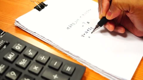 Hands using calculator laptop app calculate costs Stock Footage 219940050