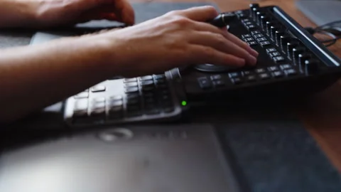 Hands Using Color Grading Control Panel and Keyboard in Modern Editing Studio Stock Footage 345692647