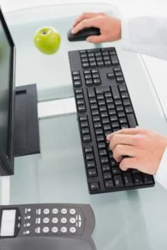 Hands using computer at medical office Stock Photos