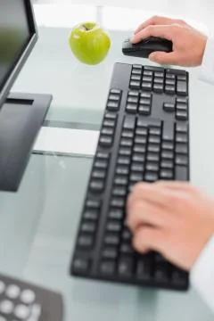 Hands using computer at medical office 写真素材