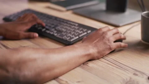 Hands using a computer mouse and keyboard Stock Footage 348505125