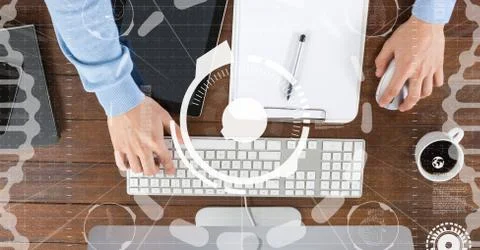 Hands using computer with overlays Stock Photos