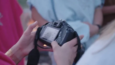 Hands using a DSLR camera in the outdoors Stock Footage 70380851