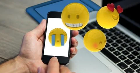 Hands using emojis on smart phone Stock Photos