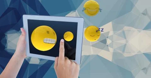 Hands using emojis on tablet PC against abstract background 스톡 사진