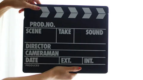 Hands using a film clapper board, close up Stock Footage 101323505