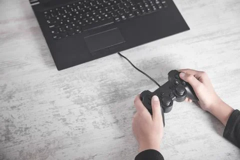 Hands using game controller. Playing video games Stock Photos