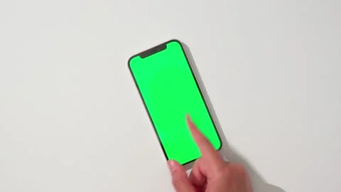 Hands using green screen smartphone, swiping Stock Footage 284266442