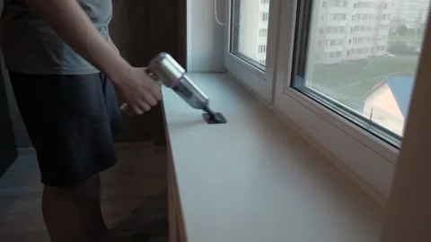 Hands using handheld vacuum cleaner Stock Footage 340016537