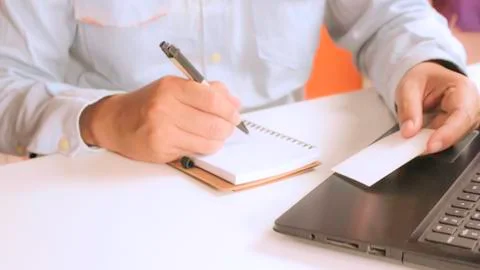 Hands using laptop and check business cards for calling online shopping Stock Photos