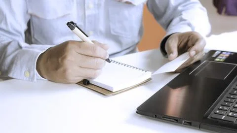 Hands using laptop and check business cards for calling online shopping wit.. Stock Photos