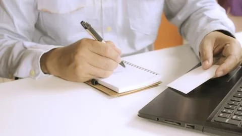 Hands using laptop and check business cards for calling online shopping Stock Photos