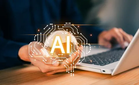Hands using laptop with glowing AI icon, symbolizing artificial intelligenc.. Stock Photos
