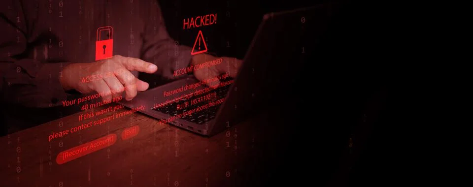 Hands using laptop with hacking alert and access denied message on screen, .. 写真素材