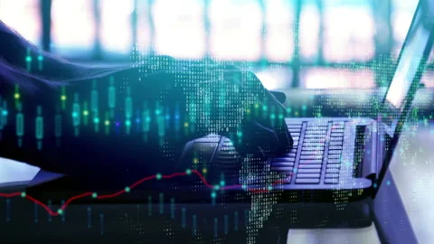 Hands using laptop with map and forex Stock Footage 99702449