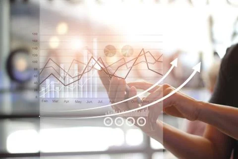 Hands using mobile analyzing sales data and economic growth graph chart Fotos de archivo