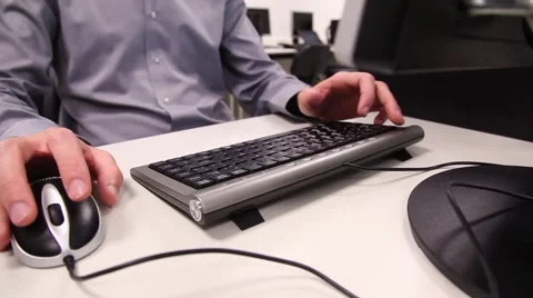 Hands using mouse and a keyboard Stock Footage 46531372