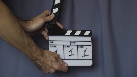 Hands using movie production clapper board Stock Footage 99913767