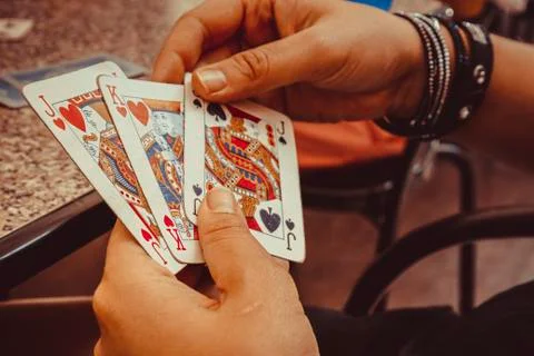 Hands using play cards Foto stock