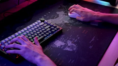 Hands Using RGB Keyboard and Mouse in Gaming Setup Stock Footage 344207943