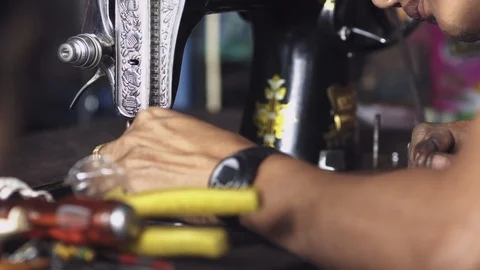 Hands using a sewing machine in Myanmar Stock Footage 95619987