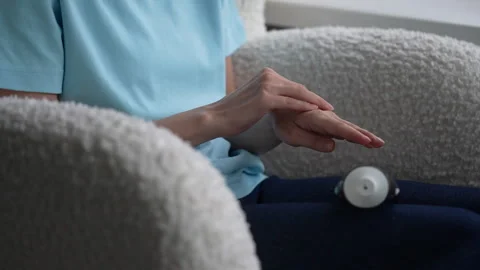Hands using simple gestures to create calming rhythms in a peaceful indoor Stock Footage 322164289