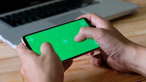 Hands using a Smart phone Touchscreen CHROMA KEY Man playing game on smartphone Stock Footage 96328063