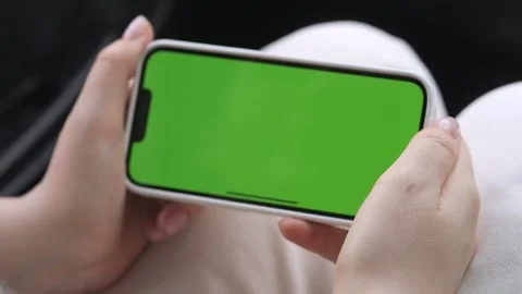 Hands using smartphone with green screen mockup Stock Footage 341070537