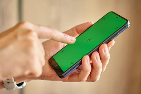 Hands using smartphone with green screen Stock Photos