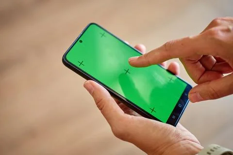 Hands using smartphone with green screen Stock Photos