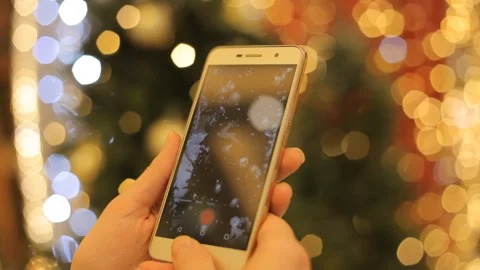 Hands Using Smartphone Shooting Christmas Video With At The Party. Closeup. Video stock 99715867