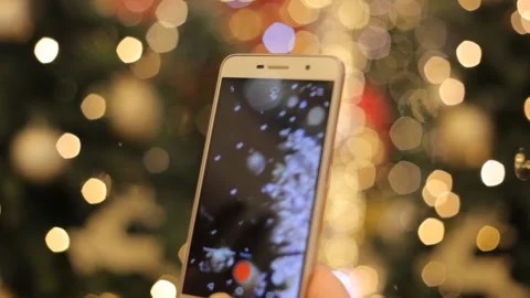 Hands Using Smartphone Shooting Christmas Video With At The Party. Closeup. Video stock 99715978