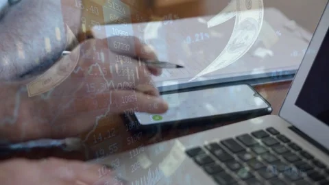 Hands Using Smartphone with Stock Market Financial Data Overlay Stock Footage 336479190