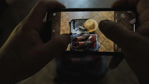 Hands using smartphone taking photos of suitcase. 4k. Close up. Stock Footage 197567449