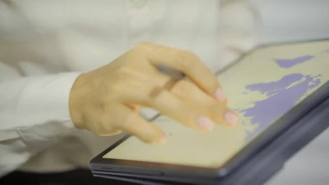 Hands using a tablet, analyzing finance and growth charts 動画素材 320536883