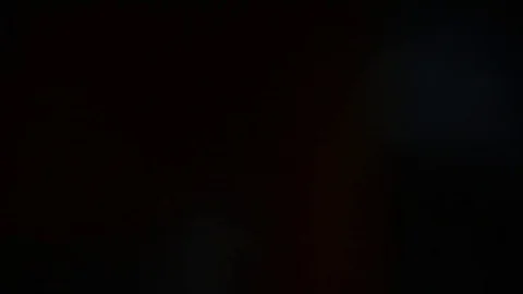 Hands using TV remote on black background Stock Footage 84936861